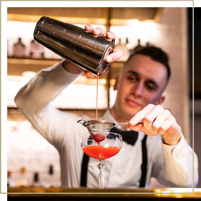 Barista pouring a cocktail at Browns Restaurant